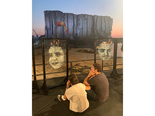 Parents of Victim Alexandra Najjar in front of her portrait Parents of Victim Alexandra Najjar in front of her portrait